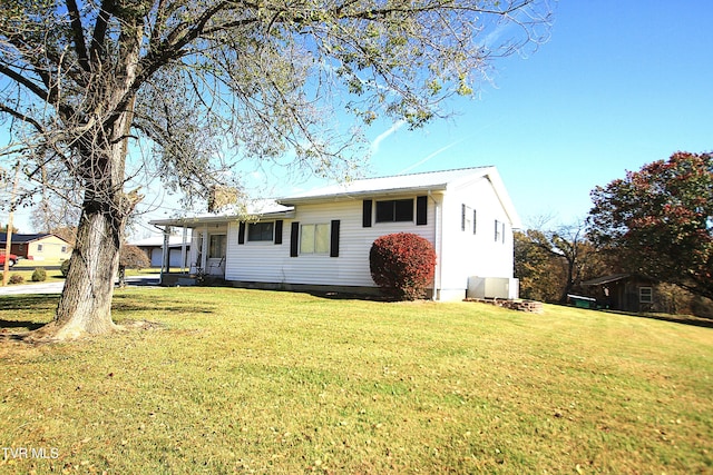 939 Muddy Creek Rd, Piney Flats, TN 37686 - view of front of house with a front yard and a metal roof