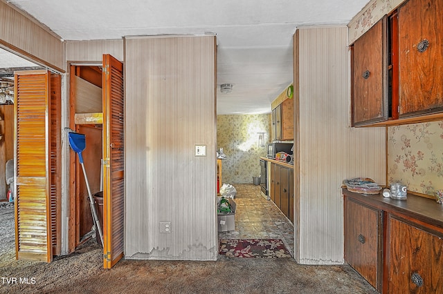 hallway with dark carpet