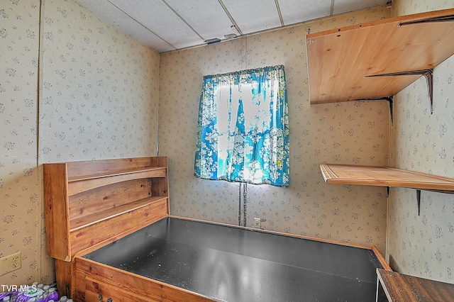 miscellaneous room with a paneled ceiling