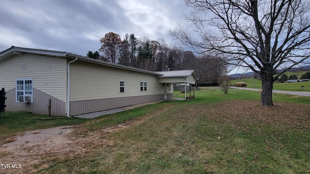 view of property exterior featuring a lawn