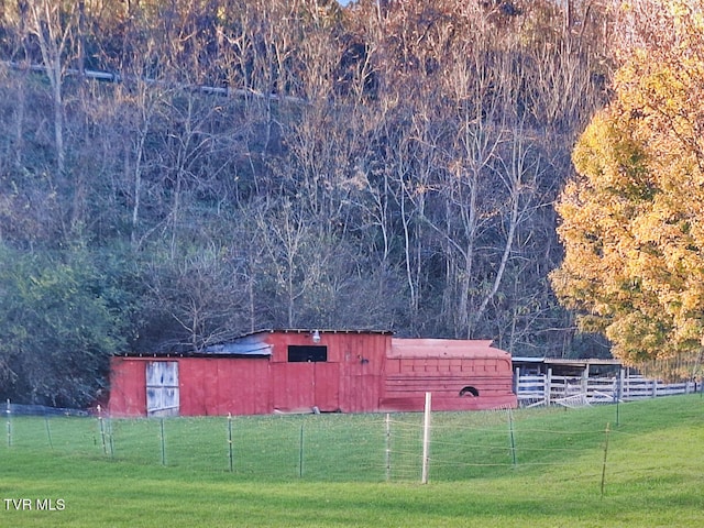 exterior space featuring a yard and a rural view