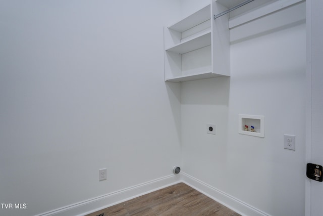 laundry room featuring hookup for an electric dryer, hardwood / wood-style flooring, and hookup for a washing machine