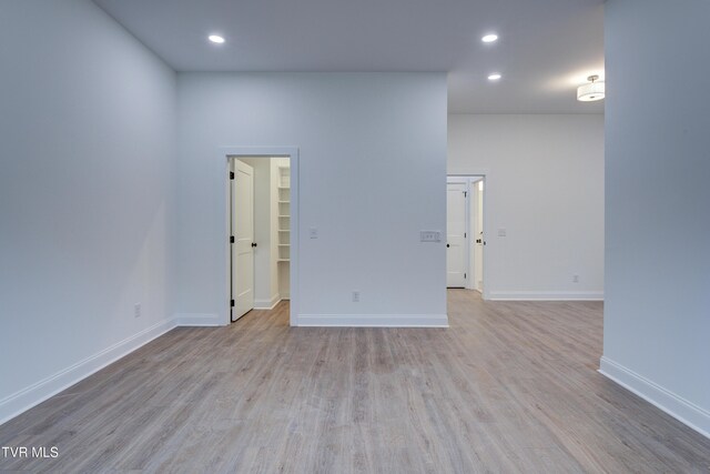 spare room featuring light hardwood / wood-style floors