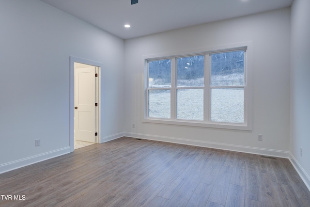 spare room featuring hardwood / wood-style floors