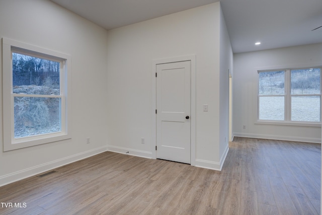 unfurnished room featuring light hardwood / wood-style flooring