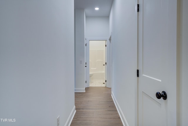 hall with light wood-type flooring