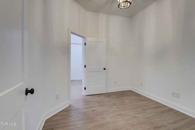 unfurnished room with light hardwood / wood-style flooring