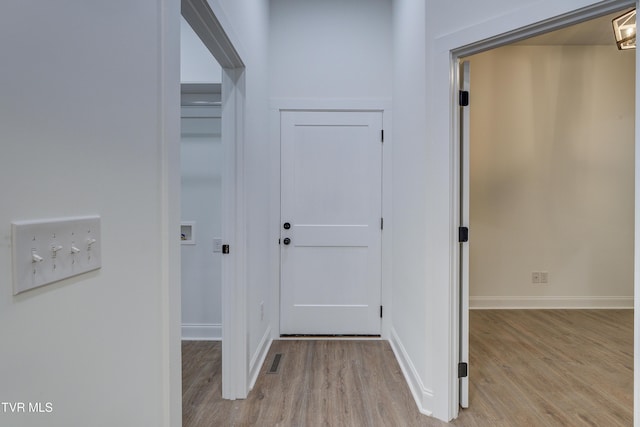 hallway featuring light wood-type flooring