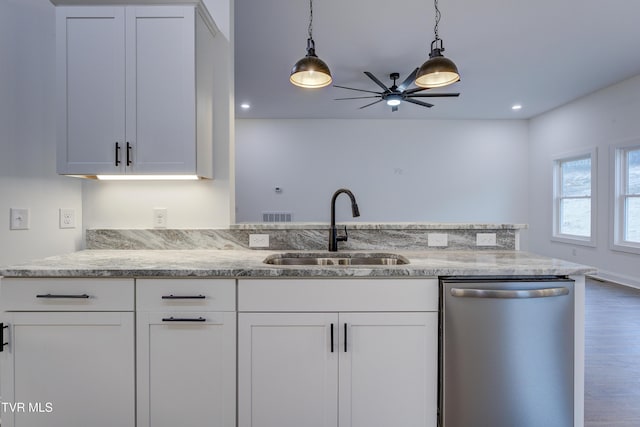 kitchen with white cabinetry, stainless steel dishwasher, and sink