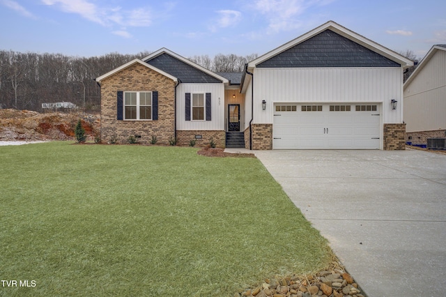 craftsman inspired home featuring a garage and a front lawn