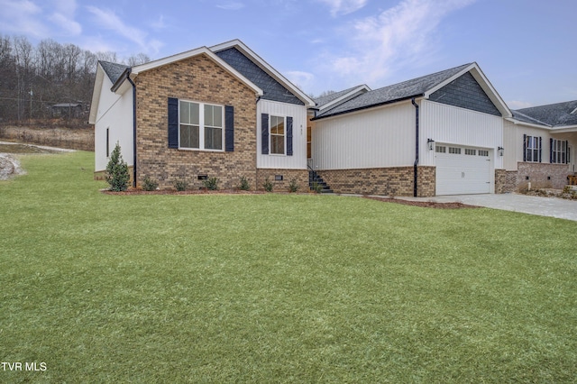 view of front of home with a front yard and a garage