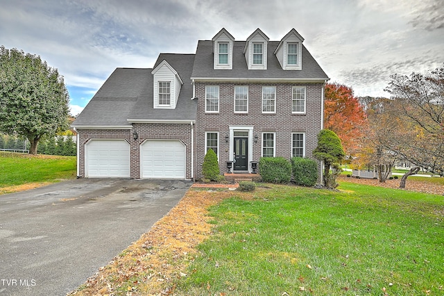 view of front facade featuring a front lawn and a garage