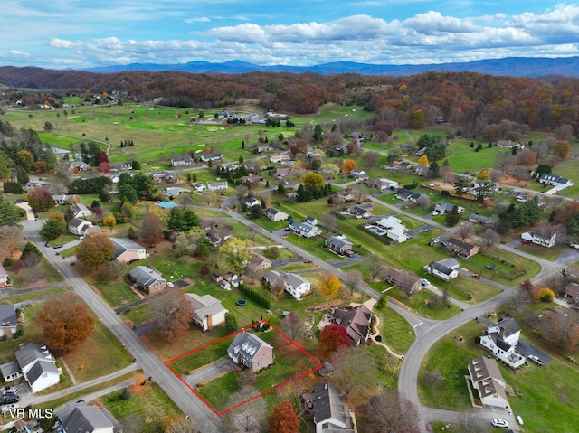 birds eye view of property with a mountain view