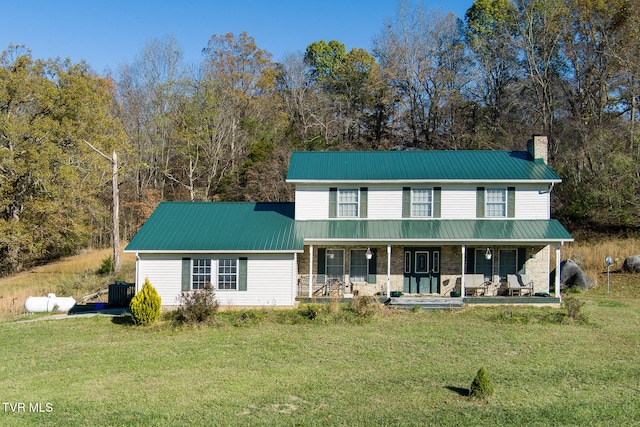 view of front facade featuring covered porch and a front yard