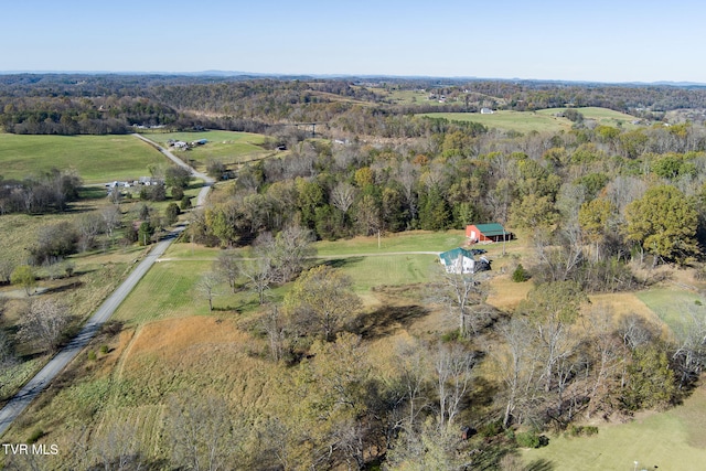 birds eye view of property with a rural view