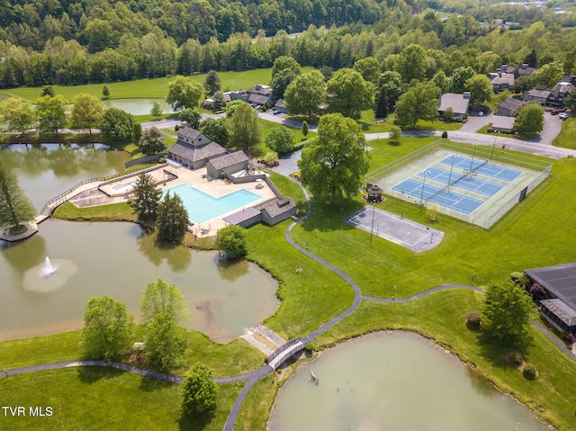 birds eye view of property with a water view