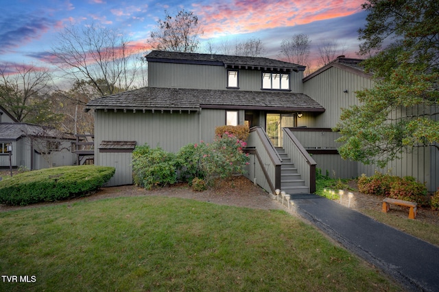 view of front of property with a lawn