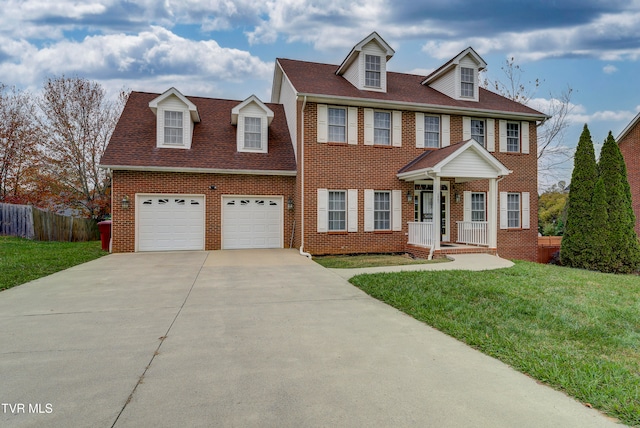 view of front of house featuring a garage and a front yard