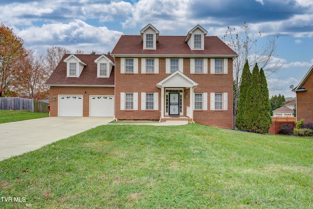 view of front of home featuring a garage and a front lawn