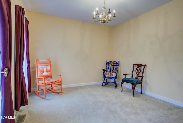 sitting room featuring a chandelier and light colored carpet