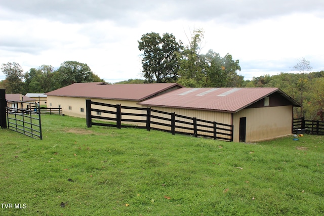 view of outbuilding with a yard