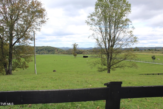 view of yard with a rural view