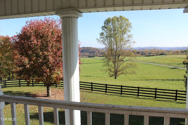 view of yard with a rural view