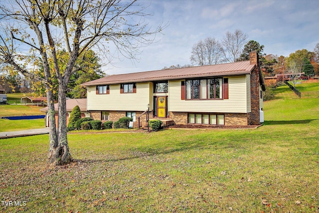 raised ranch with a front lawn