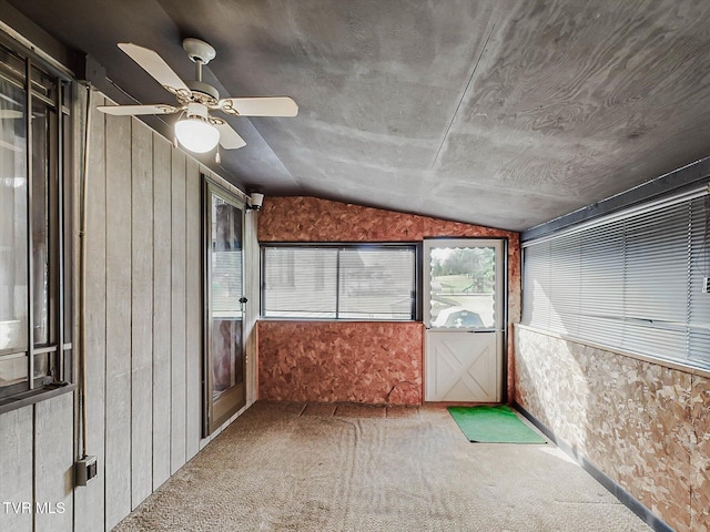 unfurnished sunroom featuring vaulted ceiling and ceiling fan