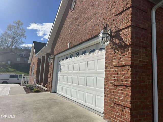 view of side of home featuring a garage