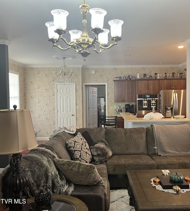 living room with a chandelier and crown molding