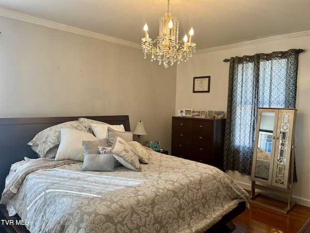 bedroom featuring wood-type flooring, a notable chandelier, and ornamental molding