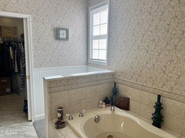 bathroom featuring tiled bath