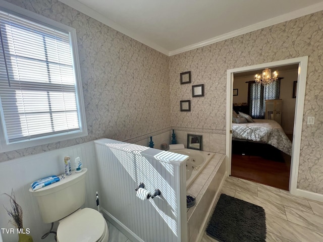 bathroom featuring toilet, a wealth of natural light, a relaxing tiled tub, and ornamental molding