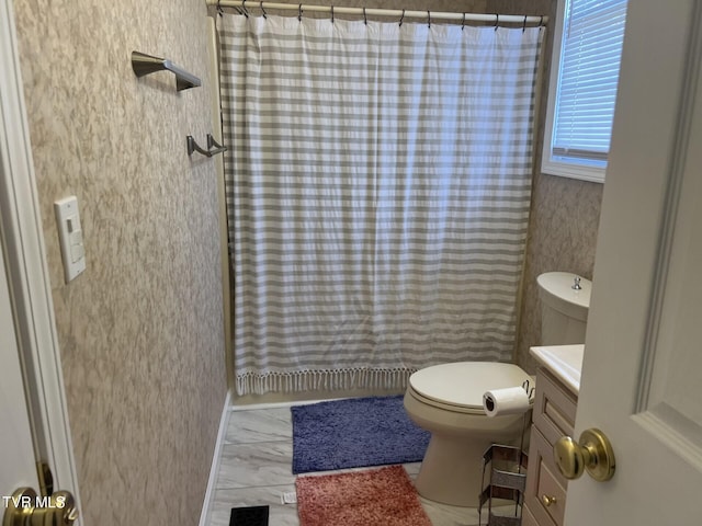 bathroom featuring vanity, toilet, and a shower with curtain