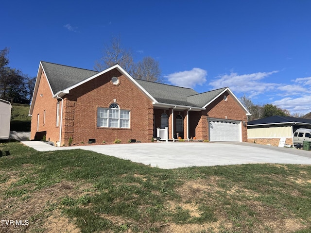 ranch-style house with a garage and a front lawn