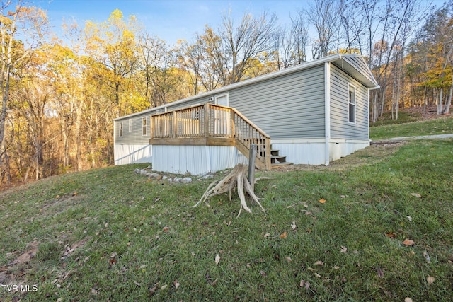 view of home's exterior with a yard