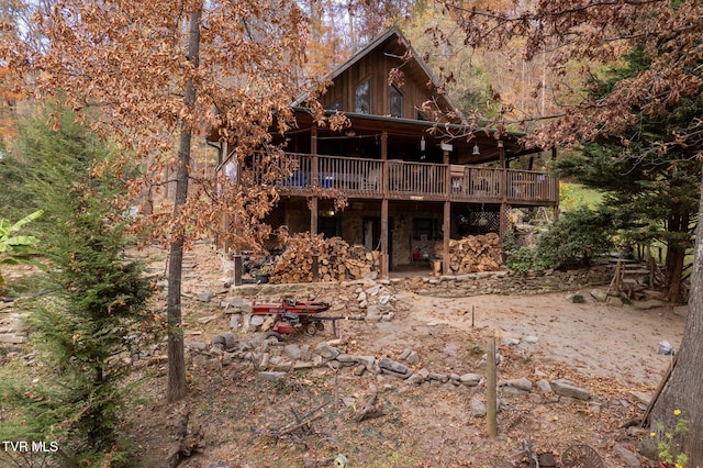 back of house with a wooden deck