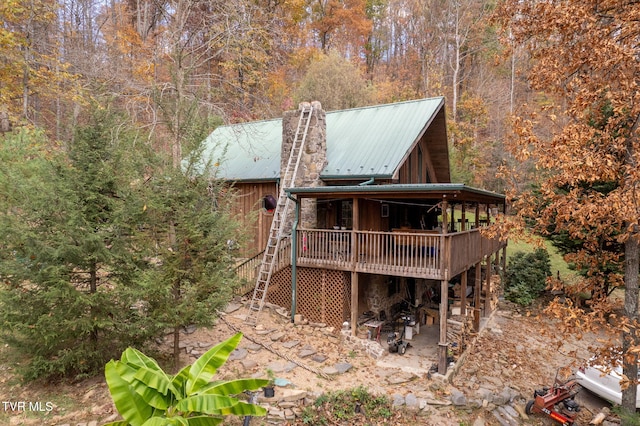 back of property featuring a deck