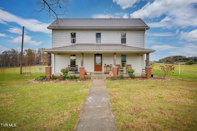 view of front facade with covered porch and a front yard