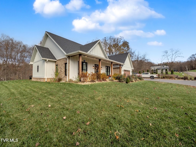 175 Deer Ridge Ct, Butler, TN 37640 - view of property exterior featuring board and batten siding, a yard, an attached garage, and concrete driveway