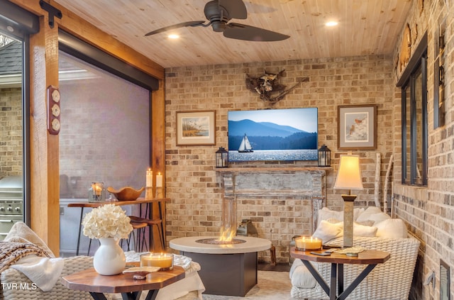 living room with wooden ceiling and brick wall