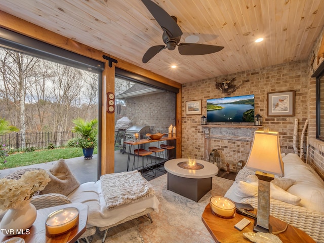 175 Deer Ridge Ct, Butler, TN 37640 - living room featuring brick wall, wooden ceiling, and ceiling fan