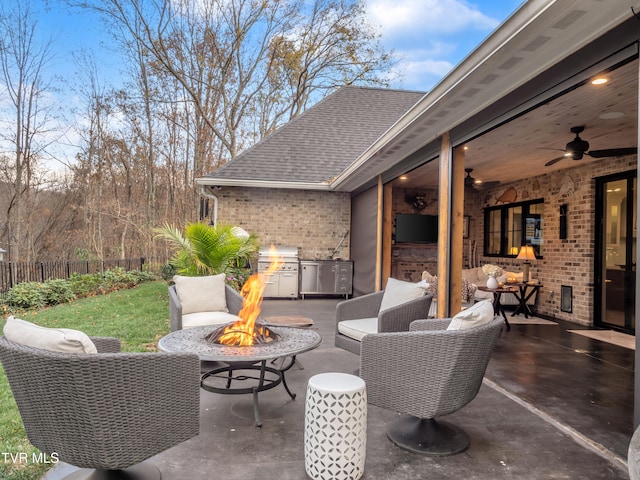 view of patio with an outdoor living space with a fire pit and ceiling fan