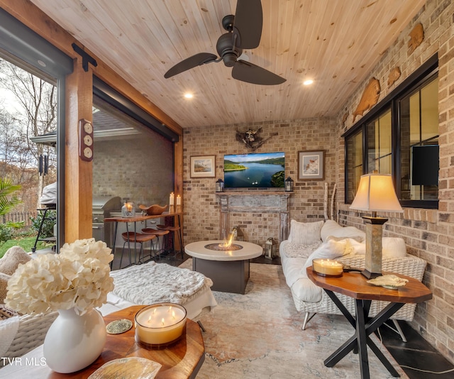 175 Deer Ridge Ct, Butler, TN 37640 - living room featuring brick wall, wooden ceiling, healthy amount of natural light, and ceiling fan