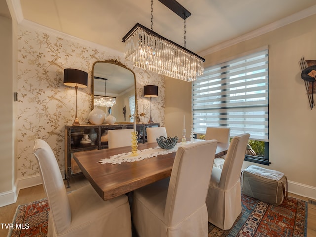 dining area with hardwood / wood-style floors and crown molding