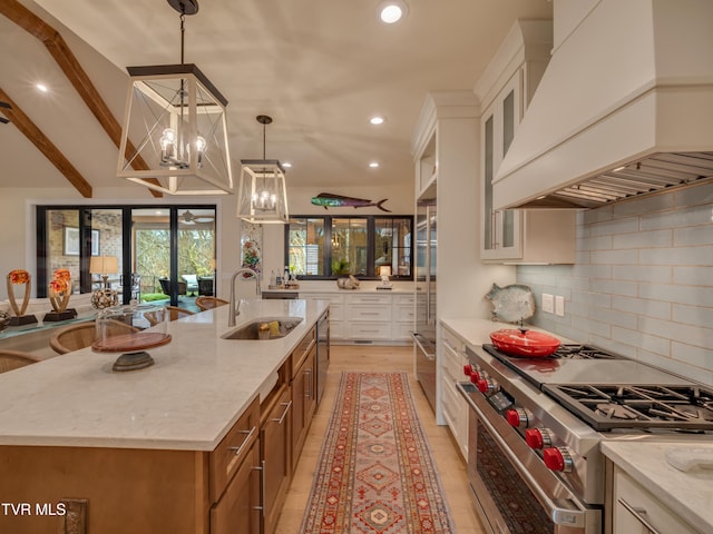 175 Deer Ridge Ct, Butler, TN 37640 - kitchen featuring high end stainless steel range oven, premium range hood, a sink, brown cabinetry, and a chandelier
