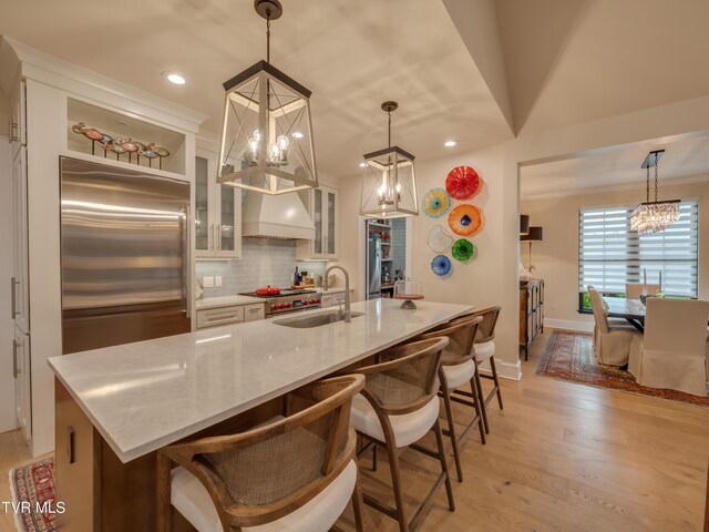 175 Deer Ridge Ct, Butler, TN 37640 - kitchen featuring a chandelier, a sink, high quality fridge, light wood finished floors, and tasteful backsplash