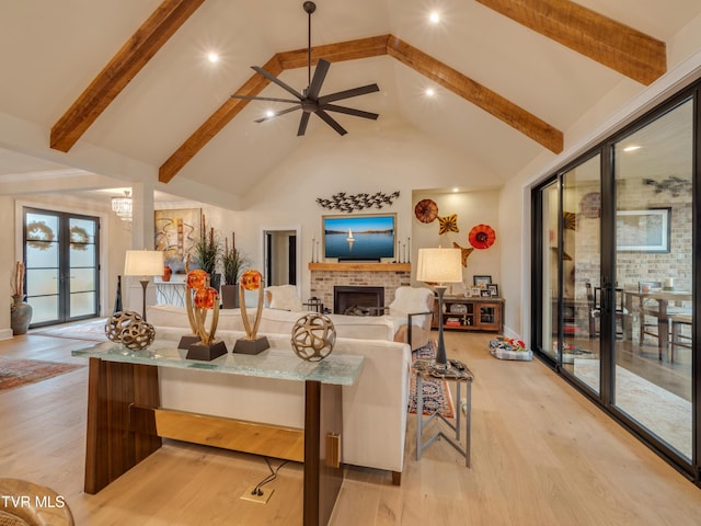 175 Deer Ridge Ct, Butler, TN 37640 - living room featuring a fireplace, beam ceiling, light wood-style flooring, high vaulted ceiling, and a ceiling fan