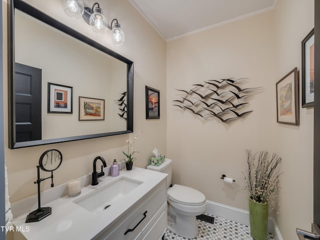 bathroom with ornamental molding, tile patterned flooring, vanity, and toilet